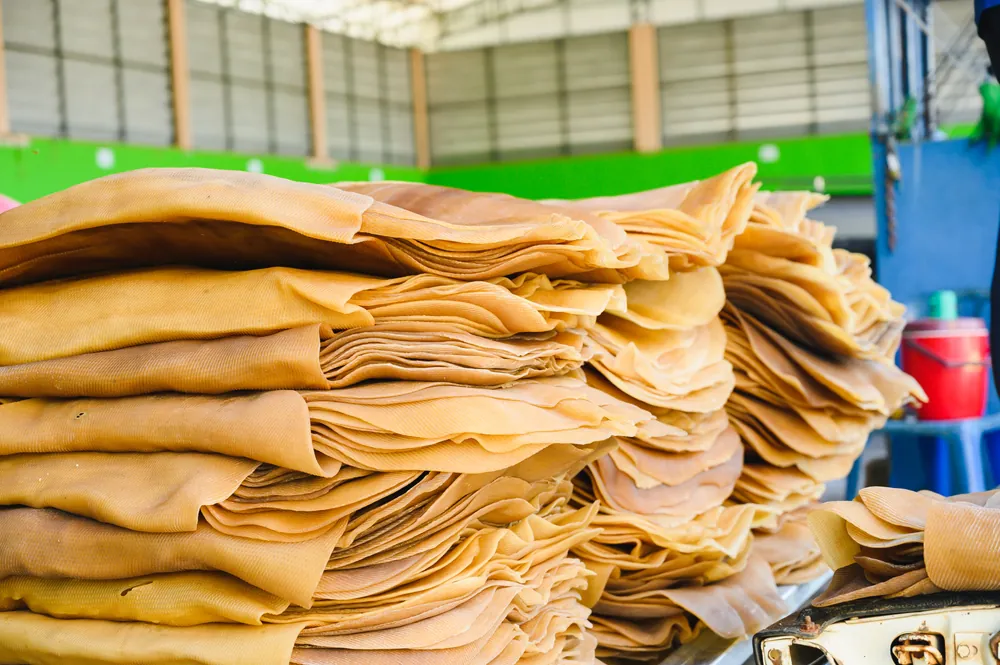 Graded rubber sheets stacked for inspection